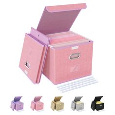 a pink file box with several different colored boxes around it and the lid opened to reveal an empty file