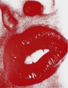 a close up view of a woman's mouth with red lipstick on the lips