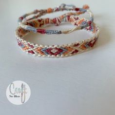 three bracelets with different colored beads on top of a white surface and the words craft for