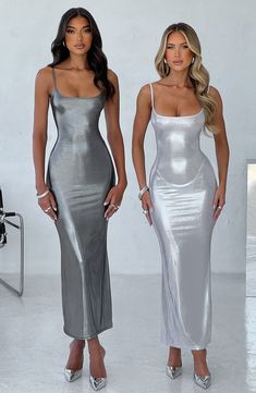 Our metallic maxi dress oozes glamour, made from a luxe semi sheer jersey that moulds to your body figure for the dreamiest fit. The dress has thin straps, flattering low scoop neckline and looks amazing worn over the Macy bralette and bottoms.



Colour: Silver.

Metallic semi sheer jersey.

Strappy.

Low scoop neckline.

Moulds to body figure.

Maxi length.

Model is an XS and is wearing an XS.

 Size: XS, S, M, L, XL, XXL Chrome Mini Dress, Metallic Maxi Dress, Metallic Silver Dress, Silver Maxi Dress, Homecoming Dresses Corset, Midi Dress Wedding Guest, Silver Metallic Dress, 13th Birthday Party, Baby Mommy