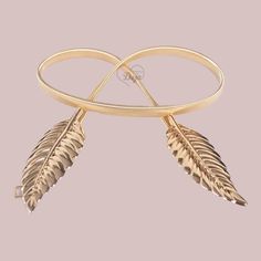 Ivy Belt Color: gold or silver Size: fits 32 to 45 inches waist Style: metal and elastic leaf shaped belt Trendy Adjustable Gold Belt, Adjustable Gold Party Belt, Elegant Adjustable Gold Belt, Leaf Shapes, Ivy, Elastic, Silver, Gold, Color