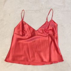 This Luxurious Silk Camisole Is By Moda International. It Is A Size Small And Features Adjustable Spaghetti Straps And An Invisible Side Zipper. It Is A Beautiful Shade Of Salmon And Is 92% Silk And 8% Spandex For A Comfy Fit. Elegant Pink Camisole With Built-in Bra, Pink Camisole For Spring Party, Elegant Pink Camisole With Adjustable Straps, Summer Party Camisole In Solid Color, Summer Party Solid Color Camisole, Pink Spaghetti Strap Top For Party, Elegant Pink Tops With Built-in Bra, Party Top With Delicate Straps And V-neck, Party V-neck Top With Delicate Straps