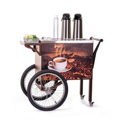 a coffee cart with a cup of coffee on the front and wheels that are attached to it