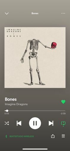 an image of a skeleton holding a red ball in its hand and the caption below reads bones imagine dragons