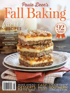 the cover of fall baking magazine features three layers of cake on a plate with a glass of milk in the background