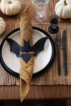 a plate with a bat napkin on it