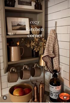 the kitchen corner is filled with coffee cups and other items, including an orange juicer