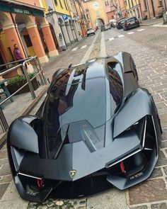 a futuristic car parked on the side of a street