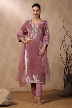 Pink velvet kurta with floral embroidered yoke and sleeve hem. Comes with chanderi pant and dupatta.
Components: 3
Pattern: Embroidered
Type Of Work: Sequins, Pearls, Cutdana
Neckline: Notched
Sleeve Type: Three Quarter
Fabric: Kurta: Velvet, Pant: Chanderi, Dupatta: Organza
Color: Pink
Other Details: 
Attached lining
Approximate product weight: 0.5-1 kg
Occasion: Wedding - Aza Fashions Luxury Art Silk Salwar Kameez For Party, Luxury Salwar Kameez For Eid Puja, Luxury Slub Silk Salwar Kameez For Wedding, Luxury Tassels Salwar Kameez For Eid, Luxury Pink Salwar Kameez For Diwali, Velvet Suits Women Indian, Velvet Pakistani Dress, Designer Lehnga Choli, Velvet Kurti