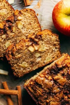 slices of apple bread on a plate next to cinnamon sticks and an apple