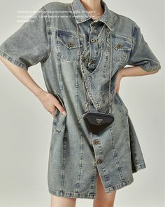 A denim dress with an eye-catching asymmetrical design.

A piece that is perfect as the focal point of your outfit.

The length makes it easy to balance, so it can be used with a wide range of coordination.
◾️Model
Height/Weight：167cm(65.7in)/45kg(99.2lb)
Fitting Size：S





Cm
(inches)

Length
Chest
Shoulder


S
79(31.1)
96(37.7)
38(14.9)


M
80(31.4)
100(39.3)
39(15.3)


L
81(31.8)
104(40.9)
40(15.7) Knee-length Denim Dress With Button Closure, Knee-length Denim Dress With Button Closure And Relaxed Fit, Non-stretch Denim Dress With Button Closure, Blue Single-breasted Denim Outerwear, Non-stretch Medium Wash Denim Dress With Button Closure, Straight Dress, Asymmetrical Design, Denim Dress, Blue Denim