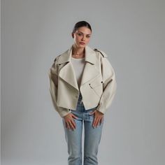 ** No Offers** I Purchased This Jacket From A Boutique In The Uk. Unfortunately It’s A Tad Too Big For Me, And The Shipping Costs Back To Uk Don’t Make It Worth Returning. It’s A Beautiful Off-White Oversized Cropped Leather Jacket That Has Slightly Puffed Sleeves With Button & Buckle Detailing. Oversized Fit And Silhouette (Allows For Layering Underneath) Outer Shell - 100% Lambskin Leather Polyester Lining Buckle Fastening Front Pocket With Decorative Button Size - Medium (Please Refer To Size Spring Biker Jacket With Lapel Collar For Work, Lapel Collar Biker Jacket For Spring Workwear, Biker Jacket With Lapel Collar For Workwear In Spring, Oversized Biker Jacket For Workwear With Long Sleeves, Oversized Long Sleeve Biker Jacket For Work, Chic Oversized Cropped Jacket With Pockets, Oversized Spring Biker Jacket With Long Sleeves, Oversized Long Sleeve Biker Jacket For Spring, Oversized Chic Biker Jacket For Fall