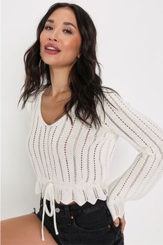 The Lulus Casual Concept White Knit Drawstring Cropped Sweater Top is your new go-to for those in-between breezy spring days! Cotton-blend medium-gauge open knit shapes this sweater top that has a V-neckline and long bell sleeves with scalloped cuffs. The cropped bodice has a drawstring tie that can be cinched to create a peplum hem. Fit: This garment fits true to size. Length: Size medium measures 19" from shoulder to hem. Bust: Great for any cup size. Waist: Not Fitted - comfortable room throu Trendy Outfits Boho, Fall Transition Outfits, Peplum Sweater, Long Bell Sleeves, Clothing Staples, Lulu Fashion, Sweater Layering, Loose Knit Sweaters, Trendy Boho