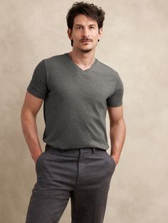 This classic v-neck t-shirt is cut from our Luxury-Touch cotton jersey—beloved for its signature softness and a smooth finish that leans more dressed-up in appearance.  V-neck.  Straight hem with vented sides.  Standard fit.  Short sleeves.  Hits at the hip.  Model: Size M, 6'2" (188cm). Mens Business Casual, V Neck Tshirt, Business Casual Men, Fashion Story, Big And Tall, Curator Style, Daily Fashion, Charcoal Grey, Black And Navy