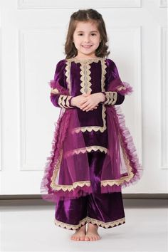 Violet velvet kurta with gold gota embellishments. Comes with pyjama and a frilled dupatta. - Aza Fashions Girls Velvet Dress Pakistani, Velvet Suit For Kids Girl, Velvet Baby Frocks, Velvet Frock For Kids, Velvet Embroidery Dress, Velvet Dresses Outfit, Velvet Suit Design