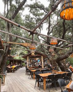 an outdoor dining area with tables and chairs