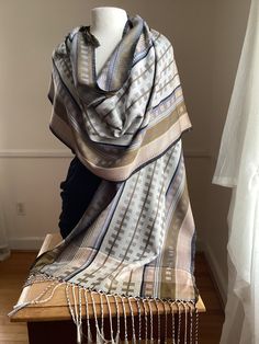 This large silk wrap is 20" by 84" and can be worn as a shawl or a large scarf. Each of my scarves and wraps is handwoven and one of a kind.I begin with pure silk, then dye it, warp it and weave it. The silk is exceptionally soft to the touch, with an elegant, soft drape.   My scarves and shawls are lightweight, breathable, yet warm. They can be warm in fall, winter and spring, and even on cool summer evenings.   They can be dry cleaned, or hand washed in cool water, with a mild soap. Handwoven Scarf, Large Scarf, Cool Summer, Silk Wrap, Summer Evening, Mild Soap, Scarf Shawl, Pure Silk, Scarf Wrap