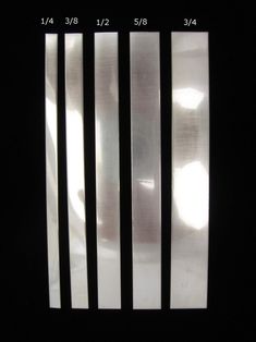 the side of a window with bars on it in black and white stripes that are not visible