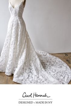 a white wedding dress on display with the words cecil hannah designed by made in italy