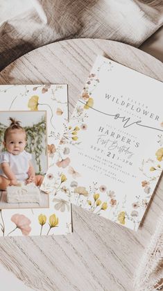 a baby's first birthday card with flowers on it and a photo in the middle