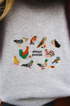 Birds & snacks ❤️🦆 ☺ 50% cotton & 50% polyester blend, with a cosy, fleece lining inside. ✐ Dreamed up, hand drawn, designed & embroidered in the UK. ✿ Hand wash if possible. Or machine wash, inside out, at 30°c. ♥ Everything is uni-sex sizing, yay! Please take a look at our size guide for more details (it's just next to the product title). ☻ Sade is a UK size 8 & wears a size L navy sweatshirt ☻ Luena is a UK size 14 & wears a size XL pastel green sweatshirt ☻ Amelia is a UK size 12 & wears a Embroided Sweatshirt, Embroidered Sweatshirt Diy, Happy Embroidery, Cool Sweatshirts, W Pictures, Gift Guide Design, Types Of Aesthetics, Cool Dude, Clothing Wishlist