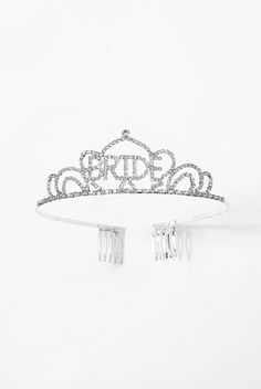 It's finally your day, so why not become the queen of your very own castle? Its elegant and majestic design is attributed to its dazzling rhinestone arrangement around the tiara, as well as its sleek and lightweight structure. Perfect for bridal showers, bachelorette parties, weddings, or any place in need of a queen! SizeLength: 5.5 in (13.97 cm)Width: 1.5 in (3.81 cm) QualityThese 'BRIDE' rhinestone crown tiaras are made with 100% eco-friendly metal alloy and are embellished with sparkly rhine Bride Tiara Bachelorette, Lightweight Structure, Bride Tiara, Bride Bachelorette, Rhinestone Tiara, Rhinestone Crown, Rhinestone Wedding, Bachelorette Parties, Tiaras And Crowns