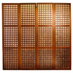 an old wooden screen with many squares on it