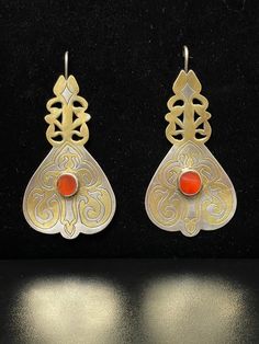 "Vintage Turkmen Tekke Tribal Earrings, made of silver and partially gilded silver with a red Carnelian stone, hand pierced Large Silver Earrings, Boho Chic Earrings, Collectable, Huge Tribal Earrings Length: 4\" Width: 2\" I am offering you these Turkmen traditional 925 Sterling Silver earrings, %100 handcrafted craftsmanship with Beautiful Carnelian Stones with fabulous craftsmanship Open studio most days from 10:00 to 5:00, DM make an appointment to have an adventure in shopping. Yes ~ along Traditional Engraved Teardrop Earrings, Pierced Carnelian Drop Earrings, Silver Carnelian Earrings For Gift, Traditional Silver Carnelian Jewelry, Traditional Carnelian Jewelry For Formal Occasions, Traditional Orange Earrings For Gift, Silver Carnelian Earrings, Elegant Silver Carnelian Earrings, Silver Carnelian Drop Earrings