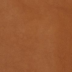 a close up view of a brown leather texture