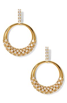 Prong-set cubic zirconia cast unparallelled shine in these 18-karat gold-plated frontal hoops. 1 1/4" drop; 7/8" width Post back 18k-gold plate/cubic zirconia Imported Gold Diamond Hoop Earrings For Party, Gold Dangle Jewelry With Pave Setting, Dazzling Gold Hoop Earrings With Diamond Accents, Glamorous Gold Earrings With Prong Setting, Glamorous Gold Jewelry With Pave Setting, Gold Dazzling Hoop Earrings With Pave Setting, Dazzling Gold Hoop Earrings With Pave Setting, Gold Sparkling Diamond Hoop Earrings, Dazzling Gold Hoop Diamond Earrings