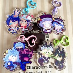 a bunch of key chains with cartoon characters on them