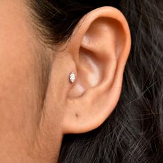 "A simple 4x2mm marquise diamond, set with V prongs in 14k solid gold - a fresh take on the classic round diamond stud. Perfect for your lobe, cartilage, conch, helix or tragus piercing. It also makes for a mesmerizing nose jewelry. * Gemstone : Natural Marquise Diamond * Marquise Diamond Wt. : 0.06-0.08 ct * Color/Clarity : G-H-I, Vs-Si * Dimension : 4 x 2mm (approx) * Gold - 14k, Solid gold If you like this stud, please press \"Pin it\" button on the top of your screen. Follow us on Instagram Minimalist Marquise Jewelry With Diamond Accents, Minimalist Marquise Diamond Accented Jewelry, Minimalist Jewelry With Marquise Diamond Accents, Minimalist Marquise Cubic Zirconia Jewelry, Dainty Marquise Diamond White Jewelry, Minimalist Marquise Cut Cubic Zirconia Jewelry, Minimalist Marquise Cut White Gold Jewelry, Minimalist Marquise Cut Diamond Jewelry, White Marquise Cut Minimalist Jewelry