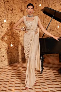 Gold cape with sequin embroidered floral blossom motifs highlighted by pearls. Comes with shimmer base pre-draped saree, padded blouse and belt. - Aza Fashions Sequin Cape, Embroidered Cape, Draped Saree, Padded Blouse, Drape Saree, Gold Silk, Fashion App, Buy Gold, Embroidered Silk