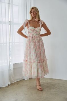 You'll love how you look in the Celine Floral Tie Strap Bustier Maxi Dress! This stunning dress features a feminine floral print, adjustable bow straps, a bustier style top, and a ruffle hem. Pair with a simple heel to complete the look! Details 100% Polyester Built in padding Tie straps Silicone grips Smocked back Back zipper Hand wash cold / Dry flat Bridal Tea Party Outfit, Tea Party Bridal Shower Ideas Outfit, Hoco Fits, Bow Strap Dress, Garden Party Dresses, Mila Dress, Wedding Guest Outfit Inspiration, Hoco 2024, Dress With Tie Straps