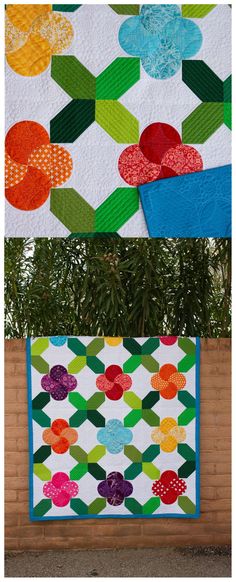 three different quilts are on display in front of a brick wall and one is made with