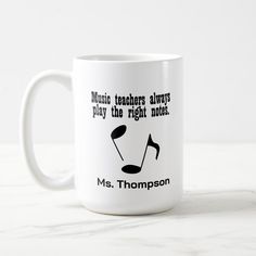 a white coffee mug with music teachers always play the right notes