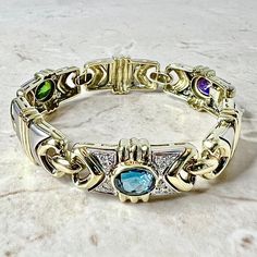 CLEARANCE 40% OFF - Vintage 1980’s 14 Karat Yellow & White Gold Blue Topaz, Green Sapphire, Amethyst & Diamond Statement Bracelet By Denoir - WeilJewelry Brazilian Jewelry, Smoky Quartz Jewelry, Gold Armband, Aquamarine Jewelry, Garnet Jewelry, Green Sapphire, Statement Bracelet, Emerald Jewelry, Jewelry Designer