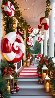 christmas decorations on the front steps of a house with red and white candy canes