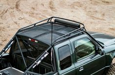 an off road vehicle parked in the dirt