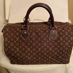 Beautiful Chocolate Colored Denim Louis Vuitton Speedy Bag .Vintage And In Great Condition .With Only One Minor Call Out , Brass Hardware Has Little Tarnish As Expected With Vintage Pieces , Zipper Works Great . Interior And Exterior Very Clean . Denim Louis Vuitton, Louis Vuitton Denim, Vintage Louis Vuitton Denim Handbags, Louis Vuitton Denim Vintage Bag, Speedy Bag, Beautiful Chocolate, Bags Louis Vuitton, Chocolate Color, Bag Vintage