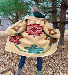 "Introducing my latest creation! Took a beautiful vintage fleece throw and upcycled into a toasty campfire coat. Front pockets so you can stash all your goodies while you prowl the festival grounds, or chill by the fire. Complete with toggle closure and front pockets. Sleeve length is 22\" Overall length is 45\" Chest measures approximately 60\" Machine washable, tumble dry on low heat. This statement jacket was made with all of my heart, for any human, anywhere, that may be attracted to its vib Bohemian Beige Outerwear With Pockets, Oversized Bohemian Outerwear For Outdoor, Bohemian Outerwear With Pockets For Outdoor, Bohemian Oversized Outerwear For Outdoor, Drape Blanket Coat, Wool Blanket Anorak, Vintage Blanket Coat, Southwest Blanket Coat, Beacon Blanket