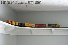 a toy train set on top of a shelf