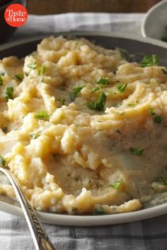 mashed potatoes with parsley on a plate