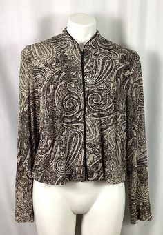 Alex Evenings paisley glitter dress jacket  Beige/taupe- with a fine black embroidered paisley design - all over glitter  Size-14WP 90% acetate-10% spandex-good 4 way stretch - very comfy on  Polester lining   Zip front  Black piping down the front and around the collar  hand wash tag  Excellent condition - Formal Paisley Print Tops For Spring, Fitted Patterned Long Sleeve Outerwear, Fitted Paisley Print Top For Fall, Elegant Paisley Print Tops For Fall, Elegant Fitted Outerwear With Paisley Print, Elegant Fitted Paisley Print Outerwear, Long Sleeve Paisley Print Fall Outerwear, Long Sleeve Paisley Print Outerwear For Fall, Paisley Jacket