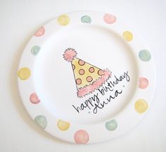 a paper plate with a party hat on it