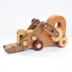 a wooden toy car with gears attached to it