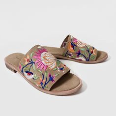 Experience luxury and style with our Rose Brown embroidered suede leather mule sandal. Made from high-quality suede leather, these mules feature intricate multicolor flower embroidery for a unique and elegant look. Slip into these mules for a comfortable and chic addition to your wardrobe. Features: Flower embroidery for floral look Cushioned footbed with suede leather covering Day to day wear Composition: Upper - 100% Leather Lining - 100% Leather Sock - 100% Leather Outsole - 100% Rubber Bohemian Spring Mules, Spring Sandals With Floral Embroidery And Round Toe, Multicolor Embroidered Open Toe Sandals For Summer, Casual Suede Slides For Spring, Spring Leather Sandals With Embroidery, Spring Embroidered Leather Sandals, Embroidered Open Toe Sandals For Spring, Spring Suede Open Toe Slides, Summer Suede Slides