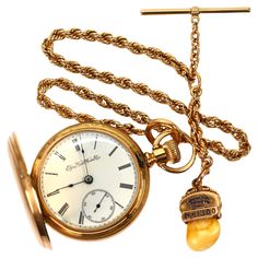 Capture a piece of history in time. This grand 14 karat yellow gold, circa 1891 Elgin National GM Wheeler Grade 103 Model 3 Pocket Watch is a true find. Manufactured pre-1900 by one of America's most highly respected watch makers of the period, its journey began with a personalization for M.M. Buss, 1893 . Added at a later date and complementing this fine pocket watch is an impressive high quality, heavy gauge 14 karat yellow gold rope watch chain with T Bar, spring ring and very unique Elks tooth Fob. The pocket watch is size 18 and Elgin number 4396998 with case number 18280. It has a pristine 17 jeweled movement with screw set jewels. The bright blue screws are flawless indicating it has only been serviced by an expert. A 5.6mm watch chain in 14 karat gold with T-Bar and spring ring acc Gold Pocket Watch, Watch Chain, Vintage Watches, Spring Rings, Pocket Watch, In Time, Elk, Gold Chains, Jewelry Watches