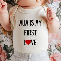 Mum is my first love onepiece romper, valentines day gift mum, pregnancy reveal one piece, baby surprise top, gift for new mum,  Color: Natural and white Packaging:  The item will be folded and individually package into resealable clear poly bags. It will then be placed inside a white polymail bag to be shipped to you. Material:  100 % cotton  Regular fit, midweight 180 gsm  preshrunk to minimise shrinkage Washing Instruction: Wash the T Shirt before wearing it. Cold, gentle wash setting with like colours only Flip the shirt inside out before washing Do not tumble dry Do not use harsh detergents or bleach Do not dry clean Warm iron, inside out This shirt is made in Australia. Please check our shop for more T shirts. Please leave us a review to help our shop grow. Mother's Day Cotton Onesie Gift, Family Matching Letter Print Onesie Gift, Cute Onesie With Letter Print For Gift, Family Matching Onesie With Letter Print As Gift, Family Matching Onesie With Letter Print, Family Matching Cotton Onesie For Mother's Day, Personalized Birthday Onesie For Mother's Day, Cute Onesie With Name Print As A Gift, Cotton Bodysuit With Letter Print As Gift