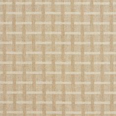 an upholstered beige fabric with white squares